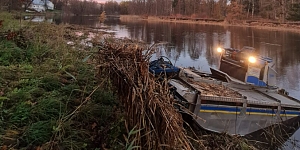 Mowing reeds and aquatic plants