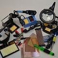 Soldering irons, tin extractors, soldering stations, loupes, layout plates, crocodile clamps, soldering accessories