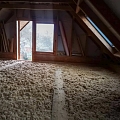 Insulating the attic of a log building with Steico Zell wood fiber wool