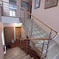 Metal railings for private houses with wooden handrails, lanterns and rod filling8